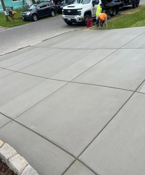 Broom finish driveway and decorate borders in Federal Way 
